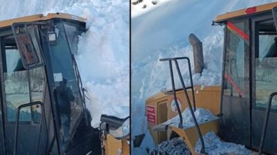 Hakkari’nin yüksek kesimlerinde karla mücadele çalışması sırasında, bir iş makinesinin